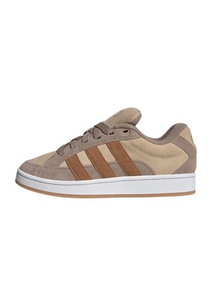 Low-top sneaker with beige and brown suede panels, brown stripes on the side, brown laces, and white rubber sole with gum outsole.