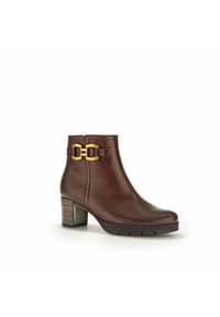 Bruine leren enkelboot met een stevige hak, gouden hardware accenten en een soepele textuur. Beschikt over een zijrits voor sluiting.