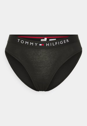 Sorte bomullsboxere med Tommy Hilfiger-logo på linningen, som har hvit skrift, røde og blå detaljer, samt en glatt tekstur.