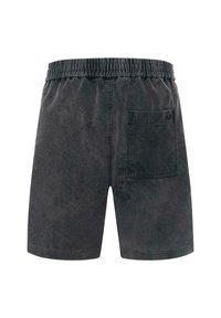 Zwarte corduroy shorts met een elastische tailleband, een enkele achterzak en een zachte textuur. Heeft een rechte snit en een lengte tot halverwege de dij.