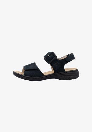Black suede sandal with open toe, adjustable buckle strap, cushioned insole, and a flexible rubber sole, designed for comfort.