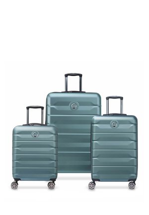 Hardshell luggage set in teal, with a ribbed texture. Includes three sizes, each with telescoping handles and smooth-rolling wheels.