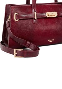 Burgundy handbag with smooth leather and fur texture. Features a gold-tone clasp and detachable leather strap. Brand name: Dune.