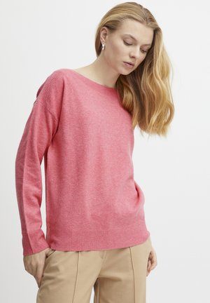 Maglione rosa lavorato a maglia con maniche lunghe e scollo rotondo. Texture morbida e sottili dettagli a costine nei polsini e nell'orlo.