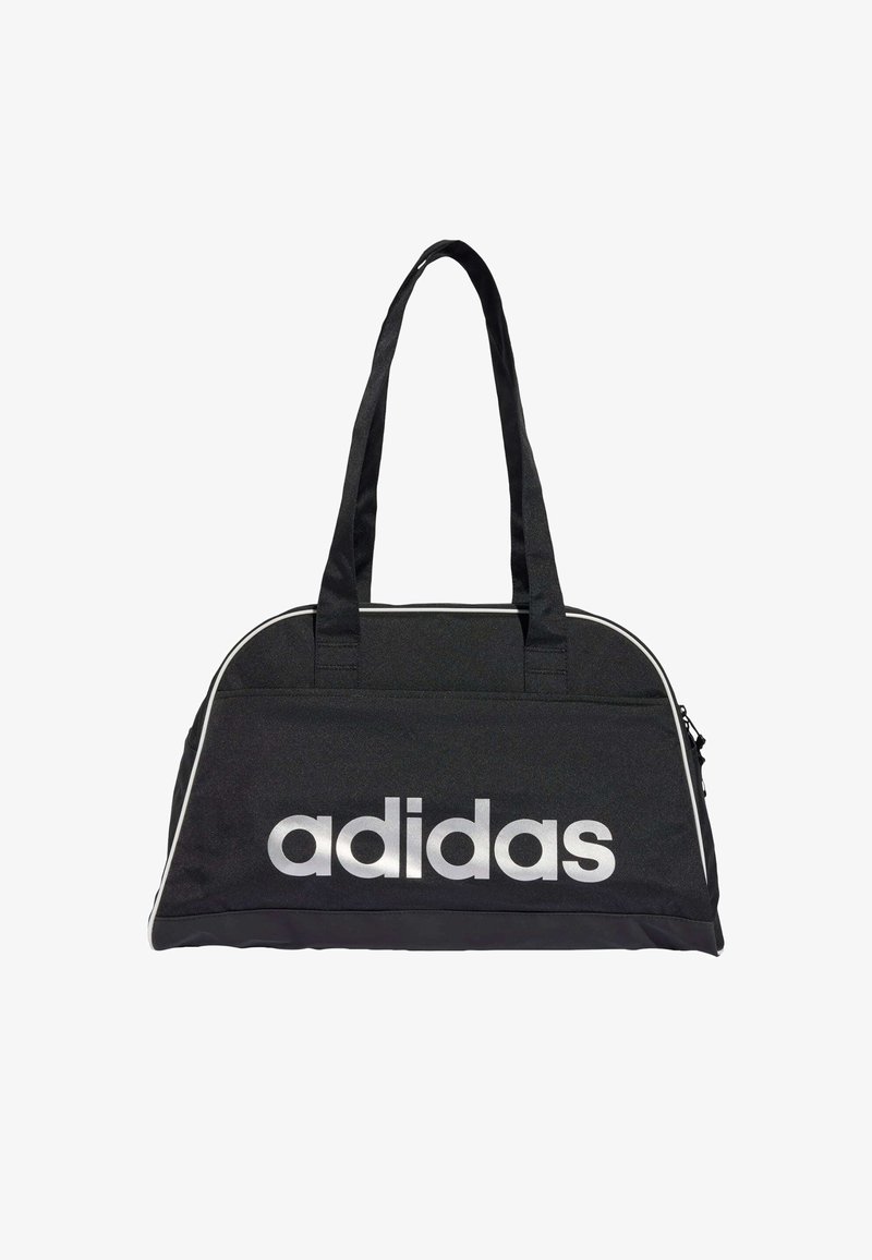 Musta reisikott, millel on hõbedane "adidas" logo, kaks tugevat käepidet ja kontrastsed valged triibud servades. Vastupidav kangas ja tõmblukuga sulgur.