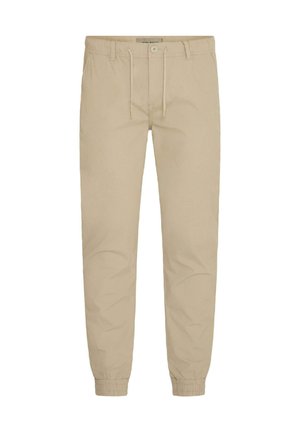 Pantaloni sportivi beige in cotone con vita elasticizzata e cordino, dotati di polsini alle caviglie e una texture liscia.