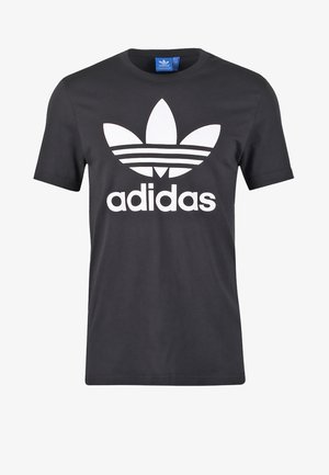 Mustapaita, jossa on lyhyet hihat, esittelee suurta valkoista Adidas-logoa ja kolmea vaakasuoraa raitaa logoa edeltä.