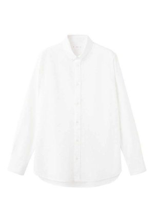 Chemise blanche à manches longues avec un col boutonné, des boutons sur le devant et un ourlet arrondi. Confectionnée dans un tissu lisse et léger.