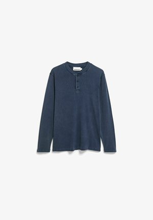 Langärmeliges Henley-Shirt in Dunkelblau. Hergestellt aus strukturiertem Stoff mit Vier-Knopfleiste sowie geripptem Kragen und Bündchen. Ohne Muster oder Verzierungen.