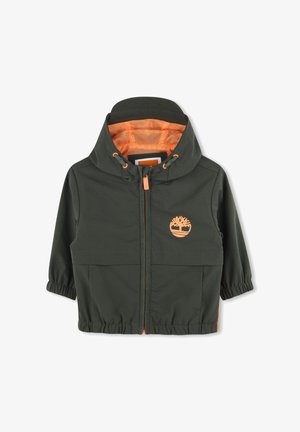 Veste verte avec une doublure en maille orange, fermeture éclair, poignets élastiques et logo sur la poitrine. Comprend des poches avant.