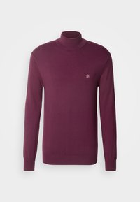 Pull col roulé bordeaux en tissu doux, avec des manches longues, des poignets côtelés et un petit logo sur la poitrine. Design simple et moderne.