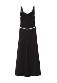 Mono negro con un cuerpo acanalado ceñido, piernas anchas y un ribete blanco contrastante a lo largo de las tirantes y la cintura. Textura suave, diseño sencillo.