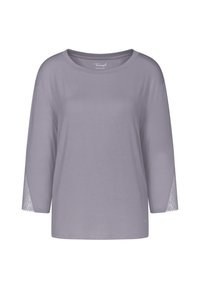 Ljus lavendelfärgad långärmad topp med rund halsringning och spetsdetaljer på ärmarna. Mjuk tyg med avslappnad passform. Inga synliga logotyper.