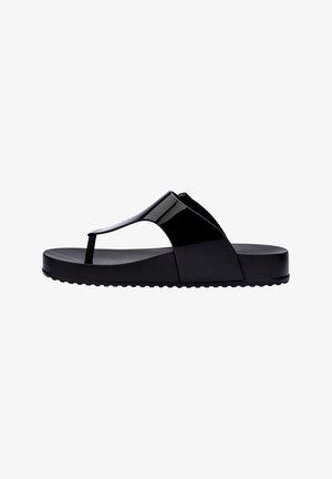 Black rubber flip-flop sandal with a glossy finish, featuring a T-strap design, flat sole, and textured base for grip.