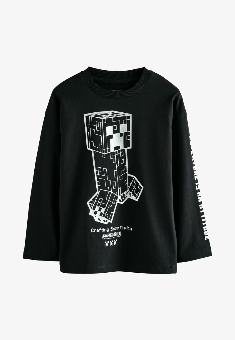 Fekete, hosszú ujjú póló fehér pixelált Minecraft karakterrel és a "Crafting Since Alpha" felirattal, valamint a "Minecraft" logóval a elülső részen.