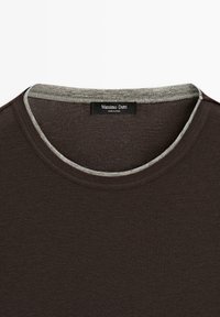 Dark brown crew neck t-shirt with contrasting gray trim inside the collar and a "Massimo Dutti" brand label sewn at the back.