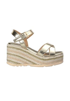Sandali wedge metallici oro con cinturini incrociati, soletta in texture juta e suola in gomma per una maggiore aderenza.