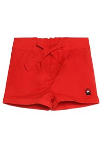 Czerwone szorty z kokardą w pasie, z bocznymi kieszeniami oraz małym czarno-białym logo grzyba na dole po prawej stronie. Gładka faktura materiału.