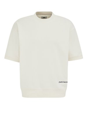 Felpa crema a maniche corte con scollatura e orlo a costine, caratterizzata da un piccolo testo nero "Downtown Social Club" sulla parte anteriore inferiore destra.