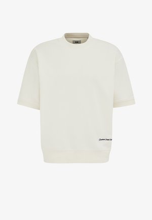 Felpa crema a maniche corte con scollatura e orlo a costine, caratterizzata da un piccolo testo nero "Downtown Social Club" sulla parte anteriore inferiore destra.