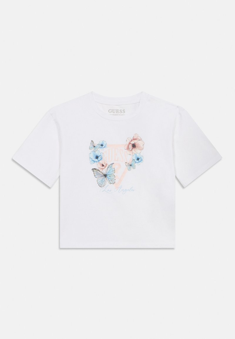 Λευκό βαμβακερό μπλουζάκι με εκτύπωση λουλουδιών και πεταλούδας σε απαλό μπλε και ροζ, με το κείμενο "GUESS Los Angeles" σε ανοιχτό μπλε. Κοντό μήκος.