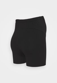 Svarte shorts med elastisk midje, laget av mykt materiale. Har en tettsittende design og en jevn tekstur, uten synlig metallisk detalj.