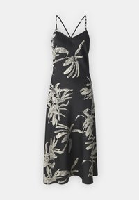 Robe nuisette noire avec imprimé feuillage tropical blanc, bretelles spaghetti, décolleté en V et silhouette fluide, confectionnée dans un tissu doux.