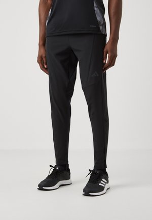 DESIGNED FOR HYBRID - Pantalon de survêtement - black