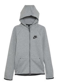 Grå zip-up hoodie med huva, tillverkad av mjukt material. Har svart Nike-logotyp på vänster bröst och framfickor. Ergonomisk design.