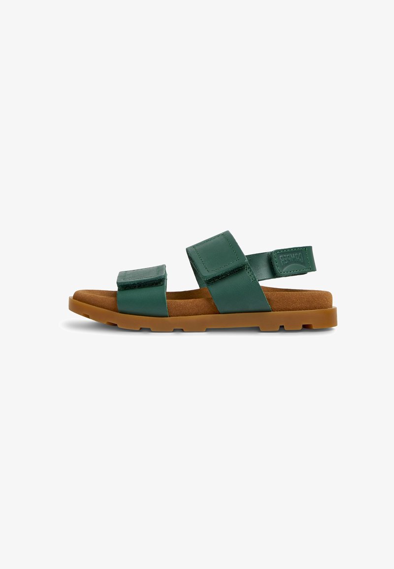 Green leather sandal with two adjustable Velcro straps and a brown cushioned sole on a white background.