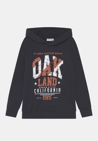 Svart huvtröja i bomull med ett grafiktryck i vitt och orange som säger "OAK LAND CALIFORNIA 1971" med vintage-stil.