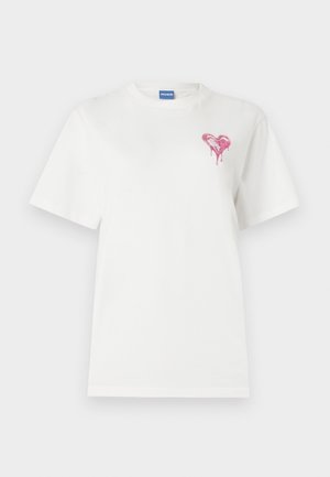 White cotton t-shirt featuring a pink dripping heart design on the left chest. Short sleeves and a rounded neckline.