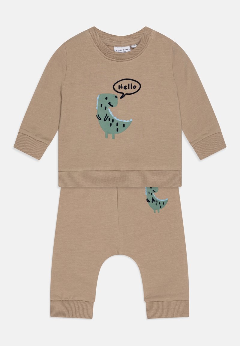 Tenue bébé beige à manches longues avec un motif dinosaure vert affichant « Hello » sur le haut et un pantalon assorti avec un petit détail dinosaure.