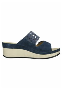 Sandali con zeppa di colore blu navy con finitura in suede. Presentano una parte superiore texturizzata con ritagli circolari, design open toe e una suola color crema.