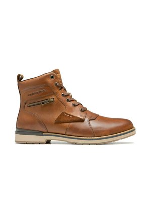 Botte en cuir tan avec un laçage à l'avant, fermeture éclair sur le côté et accents en daim. Présente une semelle en caoutchouc contrastante et des détails cousus sur le dessus.