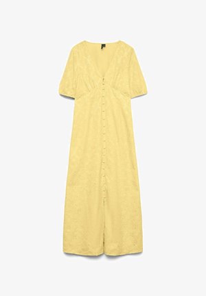 Kollane kleit V-kaelusega, lühikeste puhvvarrukatega ja nööpidega esiotsas. Omab tekstureeritud lillemustrit ja on põlvekõrgune.