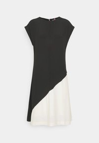 Schwarz-weißes Kleid mit einem diagonalen Schlitzdesign. Weicher Stoff, kurze Ärmel und ein Reißverschlussdetail im Rücken. A-Linie Form mit einem fließenden Saum.