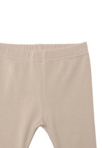 Beige gerippte Leggings mit einem elastischen Bund und einer schmalen Passform. Der Stoff ist weich und dehnbar, ideal für Sportbekleidung.
