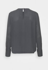 Grijze blouse met lange mouwen en een subtiele glans, voorzien van een opening met sleutelgat aan de achterkant, knoopmanchetten en een relaxed fit. Glad stoftextuur.
