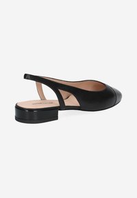 Black leather slingback shoe with a rounded toe, flat block heel, and open sides. Smooth texture with minimal accents.