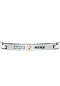 Bracciale in metallo argentato con pietre trasparenti e nere, caratterizzato da un logo a tridente dorato su una superficie lucida. Design elegante e rettangolare.