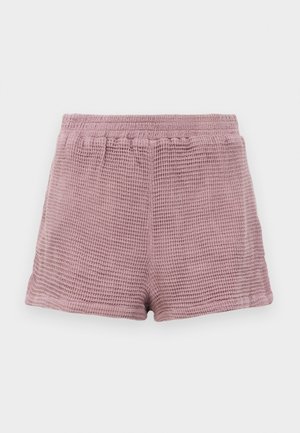 Shorts in lichtroze met wafelstructuur, een elastische tailleband en een relaxte pasvorm. Afgewerkte randen zonder zakken.