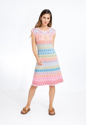 Knit sleeveless dress featuring a gradient chevron pattern in pink, blue, and yellow, with a round neckline and A-line shape.