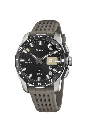 Reloj de pulsera analógico-digital con esfera negra, correa gris, iconos de control de música, batería al 87% y nombre de la marca Festina en la esfera.