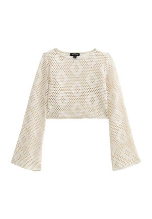 Top corto de color crema con mangas largas y acampanadas, que presenta un patrón texturizado de diamantes y un escote redondo. Fabricado con un material ligero y transpirable.