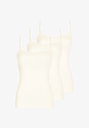 Ensemble de trois camisoles blanches sans couture avec fines bretelles, disposées en formation décalée et superposée.