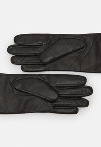 Black leather gloves with a smooth texture, featuring five fingers and additional padded accents on the palm area for extra grip.