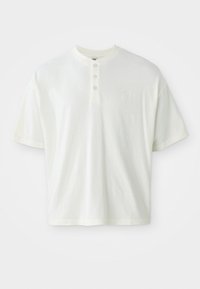 White short-sleeve shirt with a henley neckline, featuring three buttons and a small logo on the left chest. Made of cotton fabric.