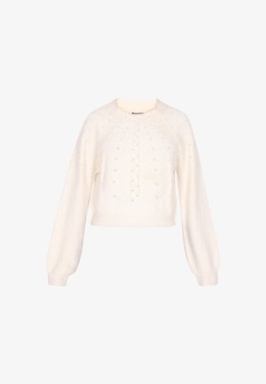 Kreemi värvi lühikese lõikega kootud kampsun, millel on pikad puffvarrukad, tekstuursete nöörmustrite ja väikeste dekoratiivsete helmestega ees.