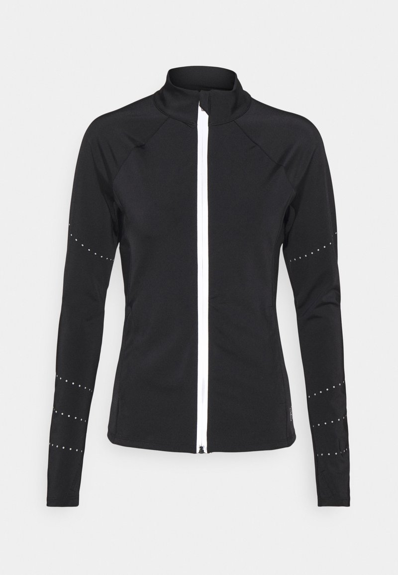 Veste de sport noire à manches longues avec une fermeture éclair blanche intégrale sur le devant et des motifs à points réfléchissants sur les manches.